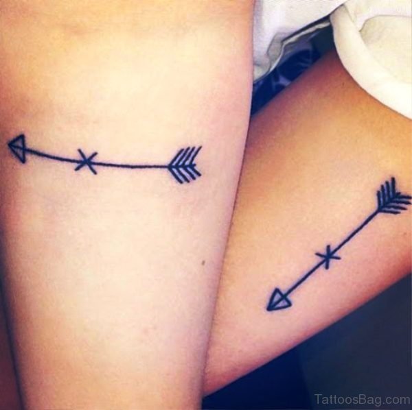 Two Little Arrows Tattoo On Arm
