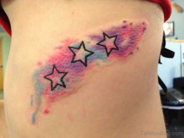 Watercolor Stars Tattoo On Rib