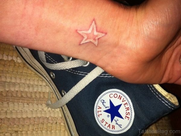 White Star Tattoo On Wrist