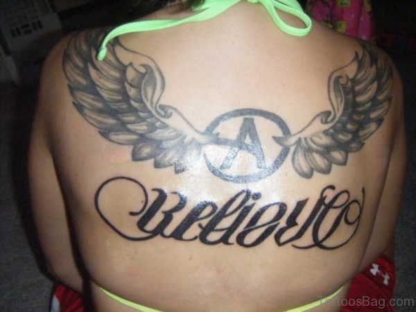 Winged A And Believe Ambigram Tattoos On Back