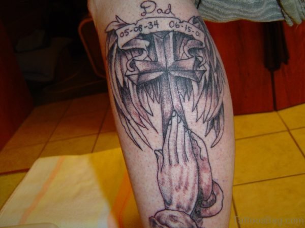Winged Cross And Praying Hands Tattoo