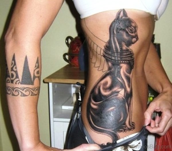Winged Egyptian Tattoo On Girl Side Rib