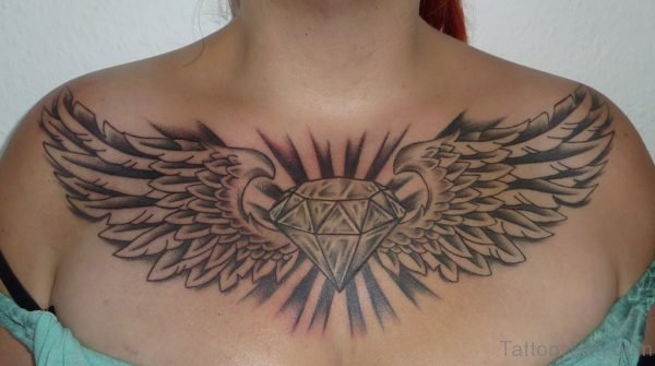 Wings And Diamond Tattoo On Chest
