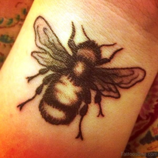 Wonderful Black Bee Tattoo On Wrist 