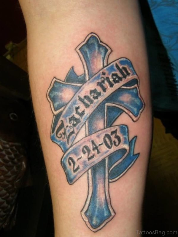 Wonderful Blue Zarhariah Banner Cross Tattoo On Forearm
