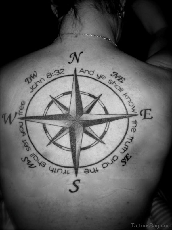 Wording And Compass Tattoo On Back