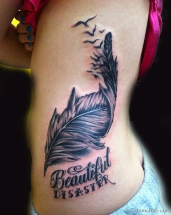 Wording And Feather Tattoo On Rib 