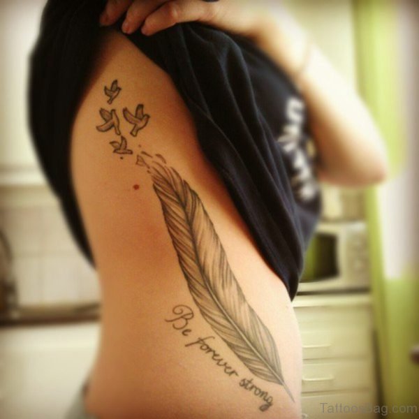 Wording And Feather Tattoo On Rib