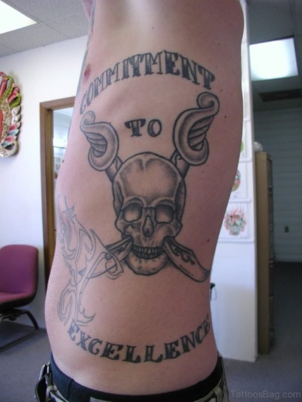 Wording And Skull Tattoo Design On Rib