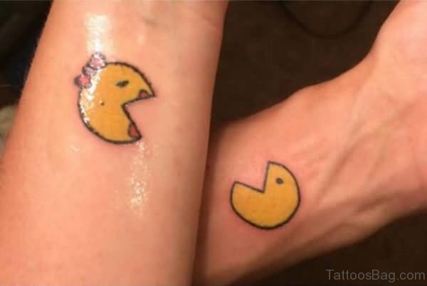 Yellow Pacman Wrist Tattoo