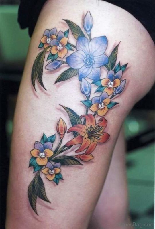 Lovely Flowers Tattoo On Thigh