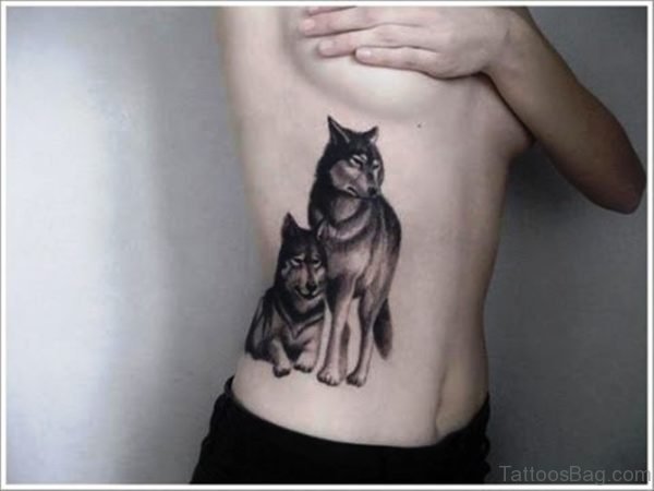 2 Alpha Wolves Tattoo Design On Rib