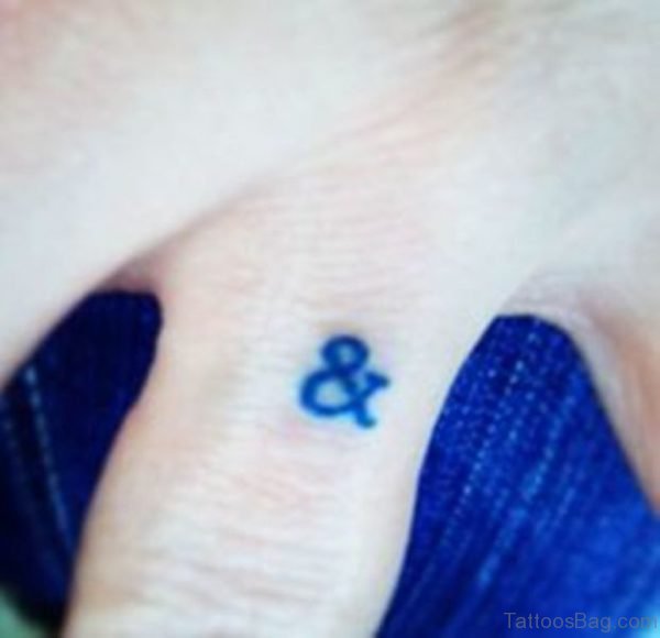 Ampersand Tattoo On Middle Finger