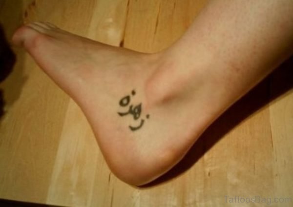 Arabic Tattoo On Left Ankle