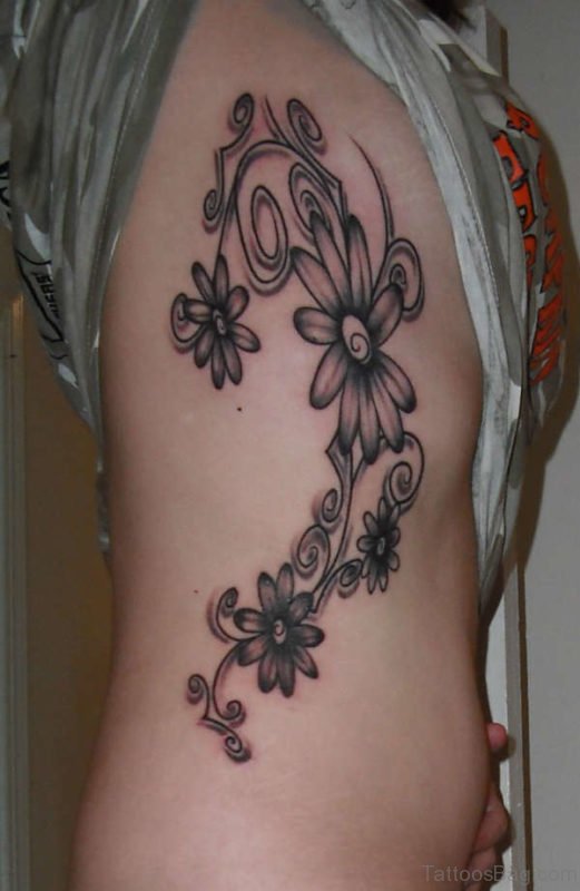 Attractive Daisy Flower Tattoo On Rib
