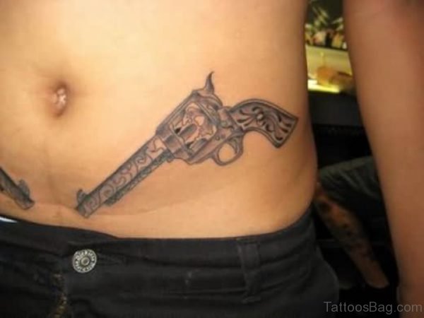 Attractive Gun Tattoo On Waist