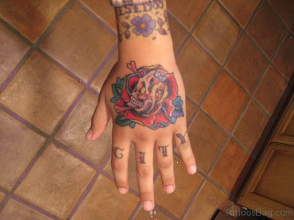 Attractive Rose Tattoo With skull On Hand