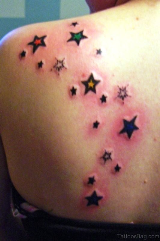 Attractive Stars Tattoo On Back Shoulder