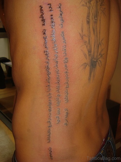 Arabic Tattoo On Back Side Rib 