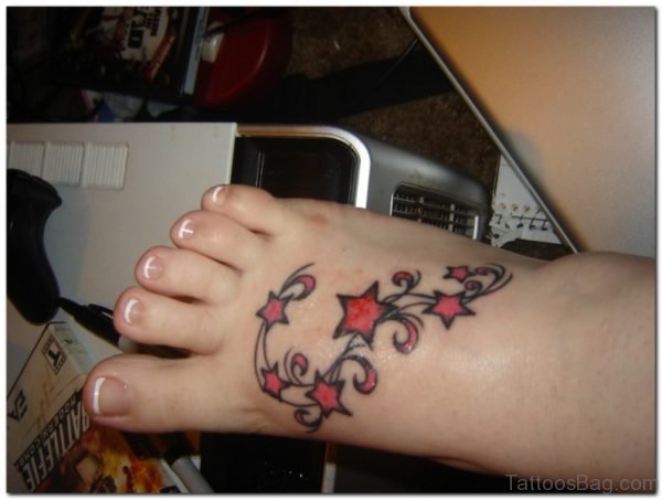 Black ANd Red Star Tattoo On Foot