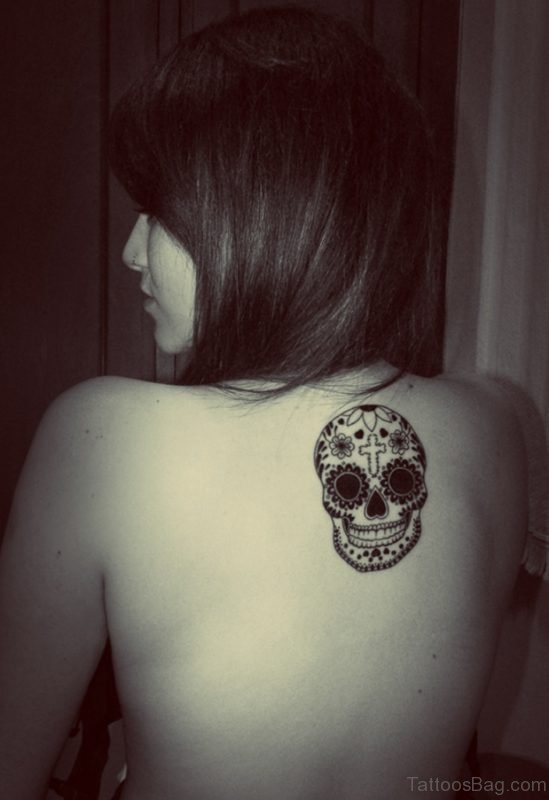 Black And White Mexican Skull Tattoo On Upper Back