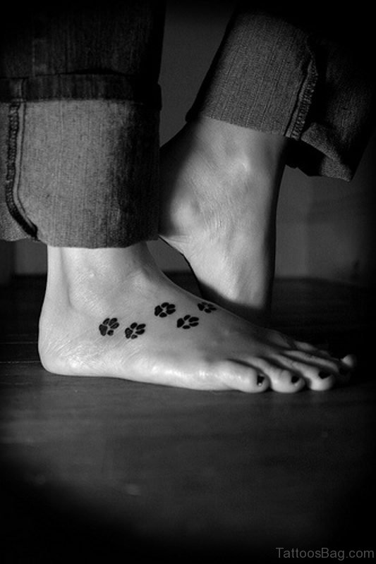 Black And White Paw Tattoo On Foot