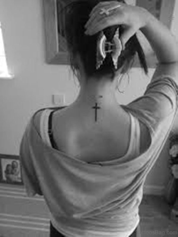 Black Cross Tattoo On Girl Nape Image
