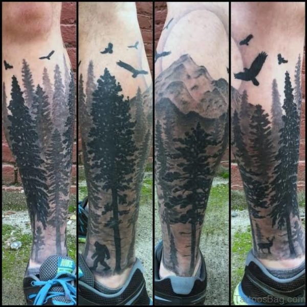 Black Flying Birds And Forest Tree Tattoo On Leg
