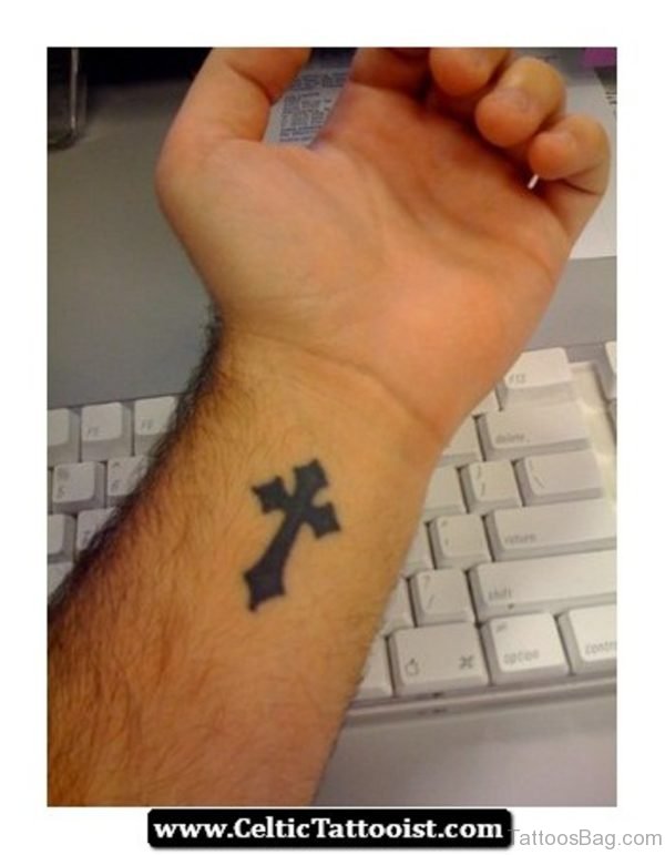 Black Ink Cross Tattoo On Wrist 