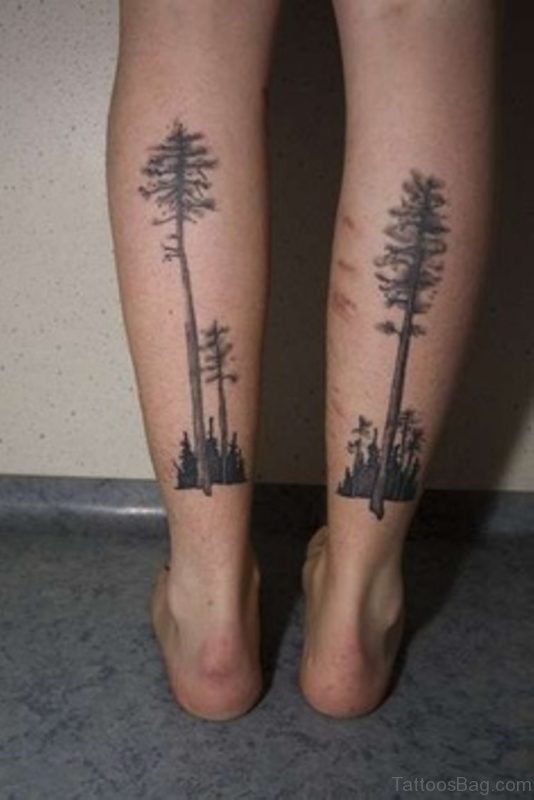 Black Ink Tree Tattoo On Both Leg Calf