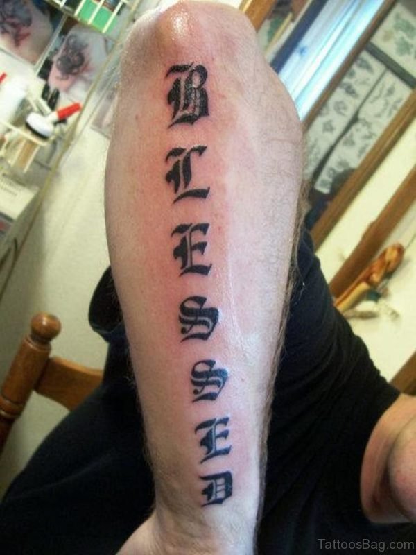 Black Lettering Tattoo On Arm 