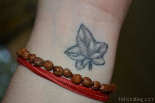 Black Maple Leaf Tattoo On Wrist