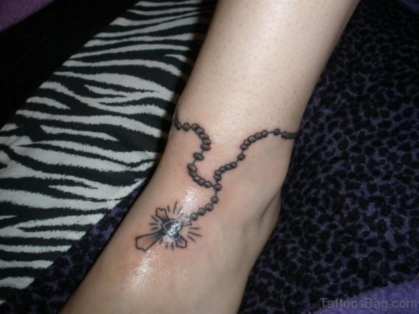 Black Rosary Tattoo On Ankle Image