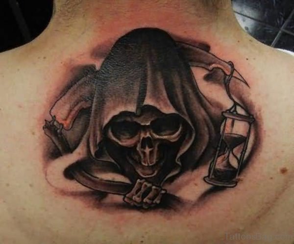 Black Skull Tattoo On Upper Back