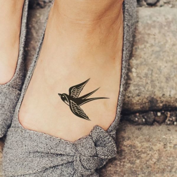 Black Swallow Tattoo On Foot 