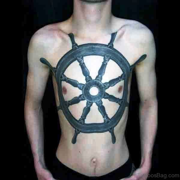Black Wheel Tattoo On Chest