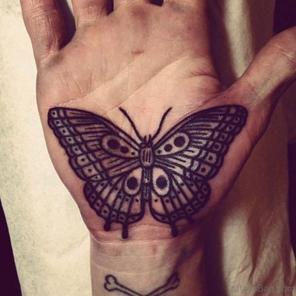 Black ink outline butterfly tattoo