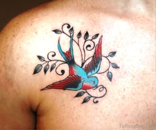 Blue Bird Tattoo On Chest With Leaves