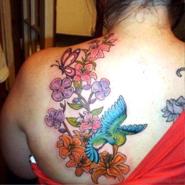 Blue Bird With Colorful Flowers Tattoo