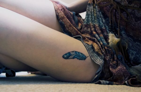 Blue Feather Tattoo On Left Thigh