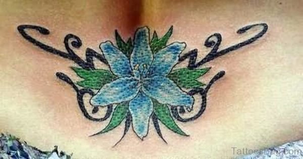 Blue Lily Flower Tattoo On Lower Waist