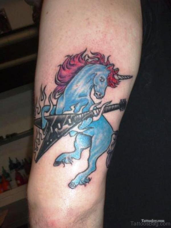 Blue Unicorn With Guitar Tattoo