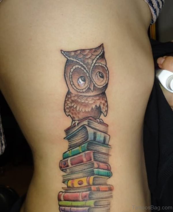 Books And Owl Tattoo On Rib 