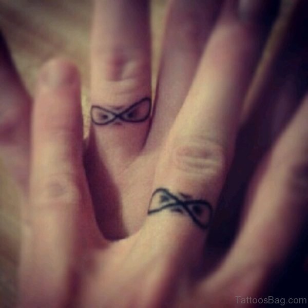 Bow Tattoo On Finger 