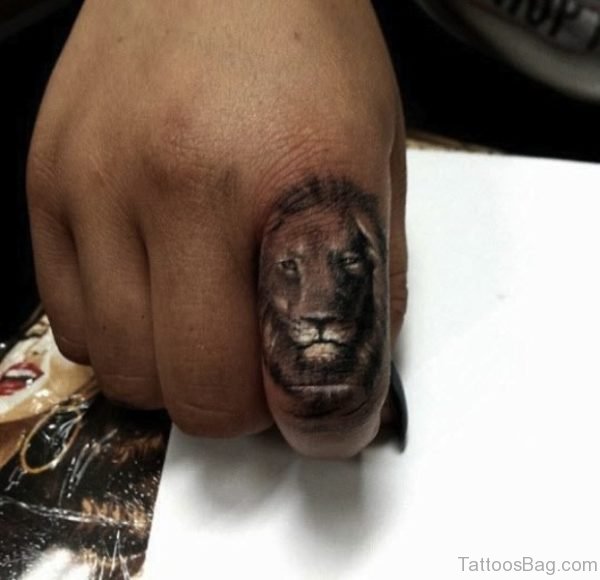 Brown Lion Tattoo On Finger