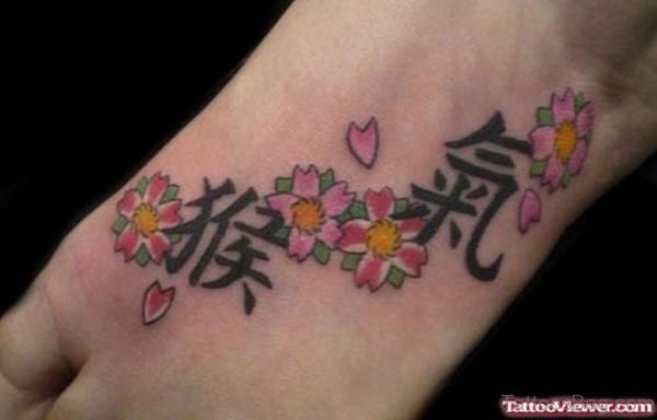 Chinese Letters Tattoo On Foot 