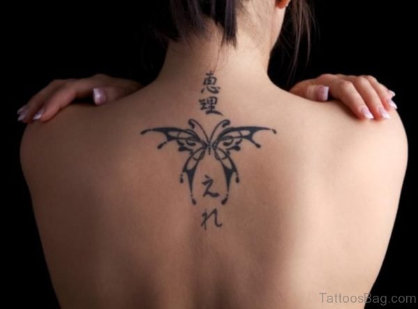 Classic Black Butterfly Tattoo On Upper Back