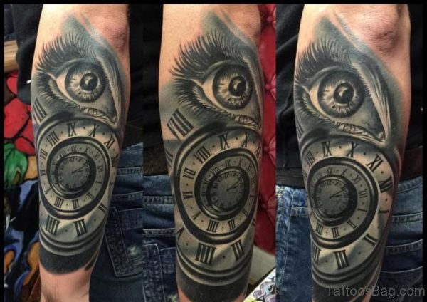 Clock And Eye Tattoo On Arm
