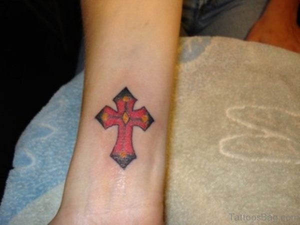 Colored Cross Tattoo On Wrist 