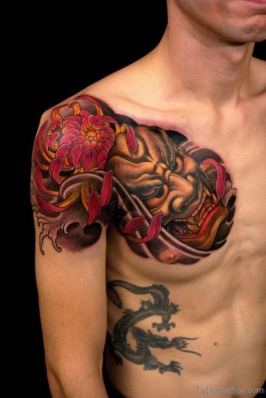 Colored Devil Mask Tattoo On Chest